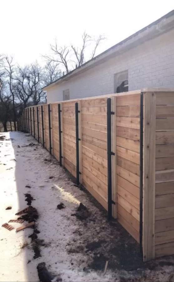 Horizontal cedar fence on steel posts