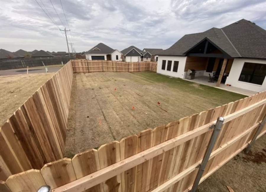 Cedar picket fence on steel posts